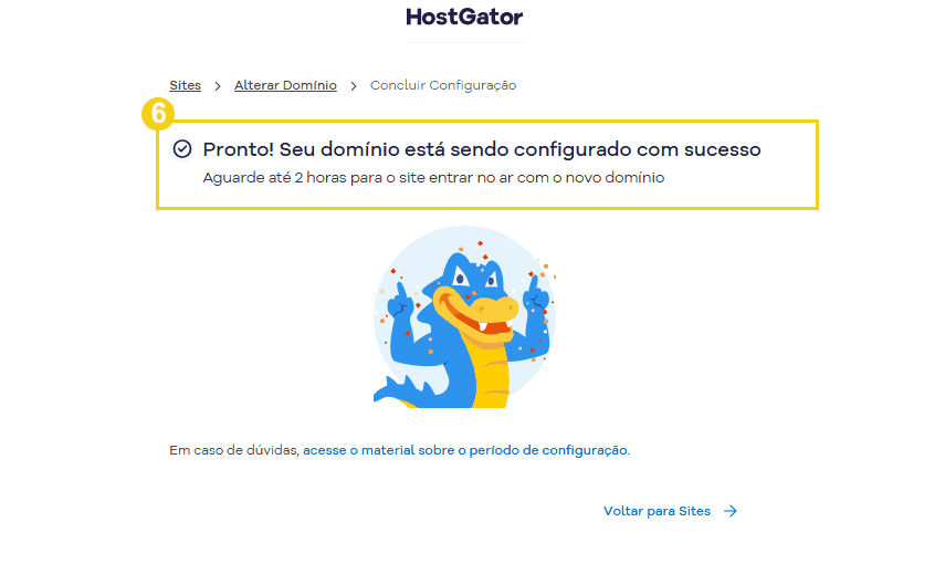 Tela de confirmação de configuração concluída no HostGator, com destaque para mensagem de sucesso e um mascote de dragão sorridente.