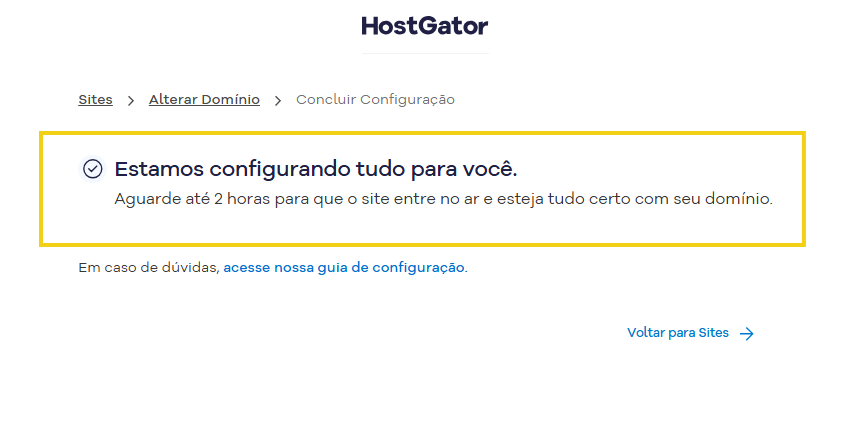 Imagem da tela Concluir Configuração da HostGator, com a mensagem de que a configuração do domínio está em andamento e a orientação para aguardar até 2 horas para que o site volte ao ar.